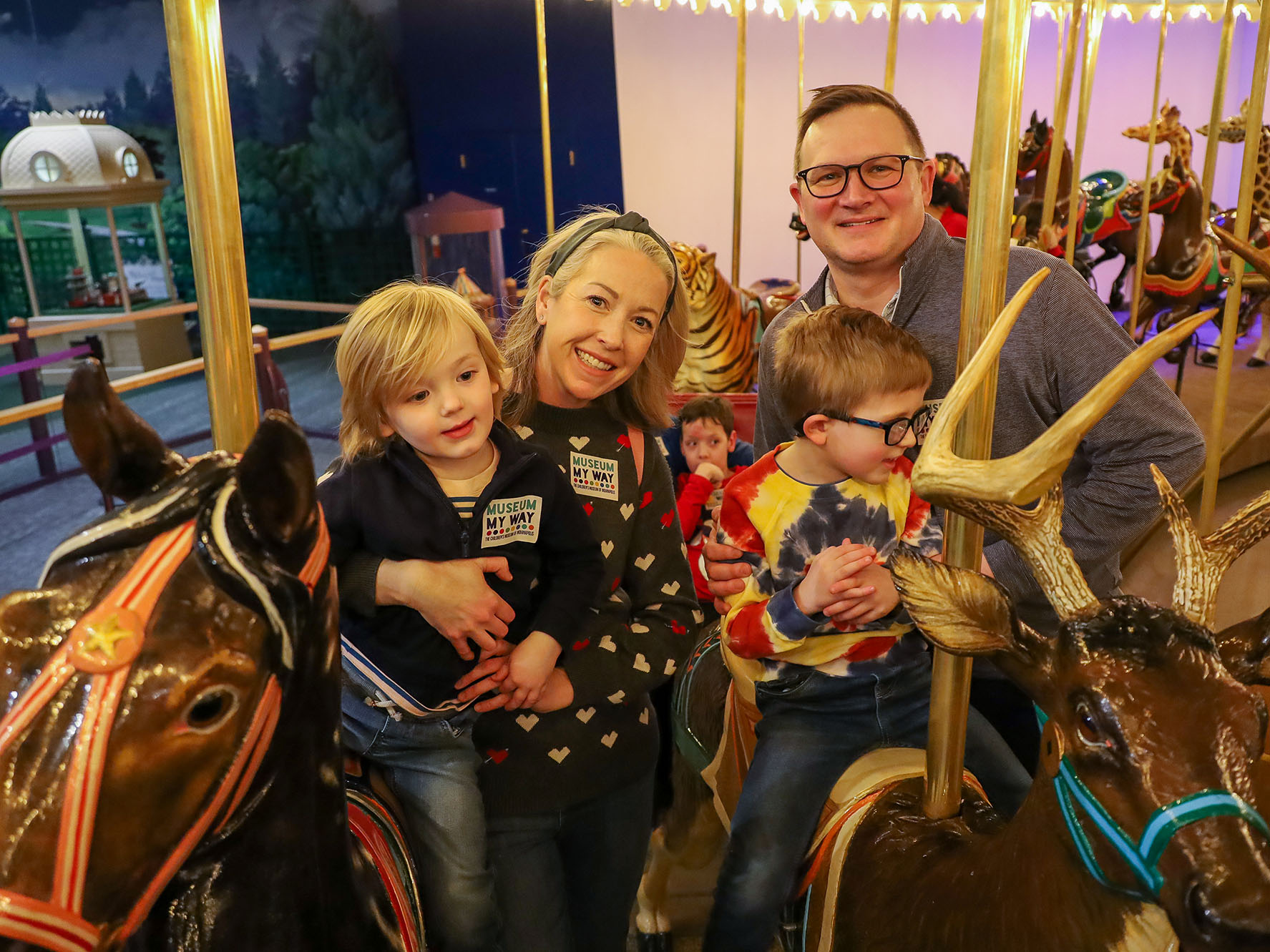 Family on Carousel.