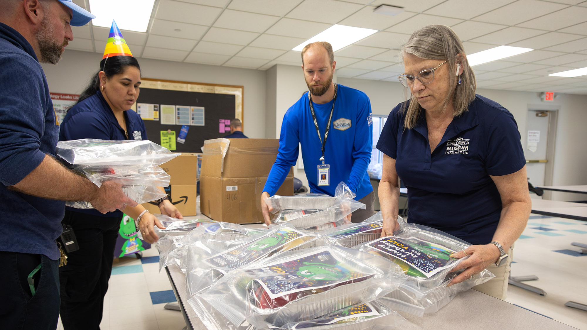 Museum staff members making cake donation kit.