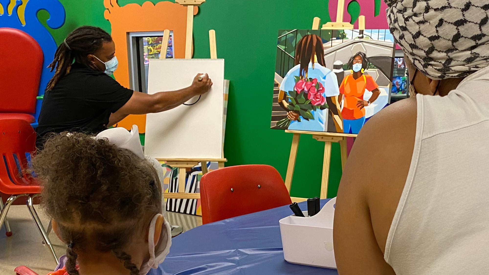 Visiting Artist demonstrating his painting technique.